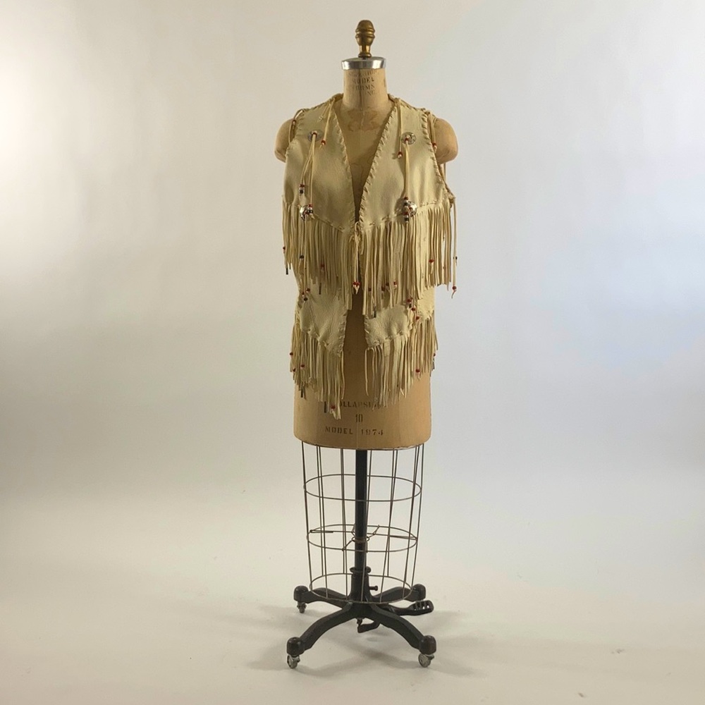 Western cream leather vest with silver conchae and beads and fringe